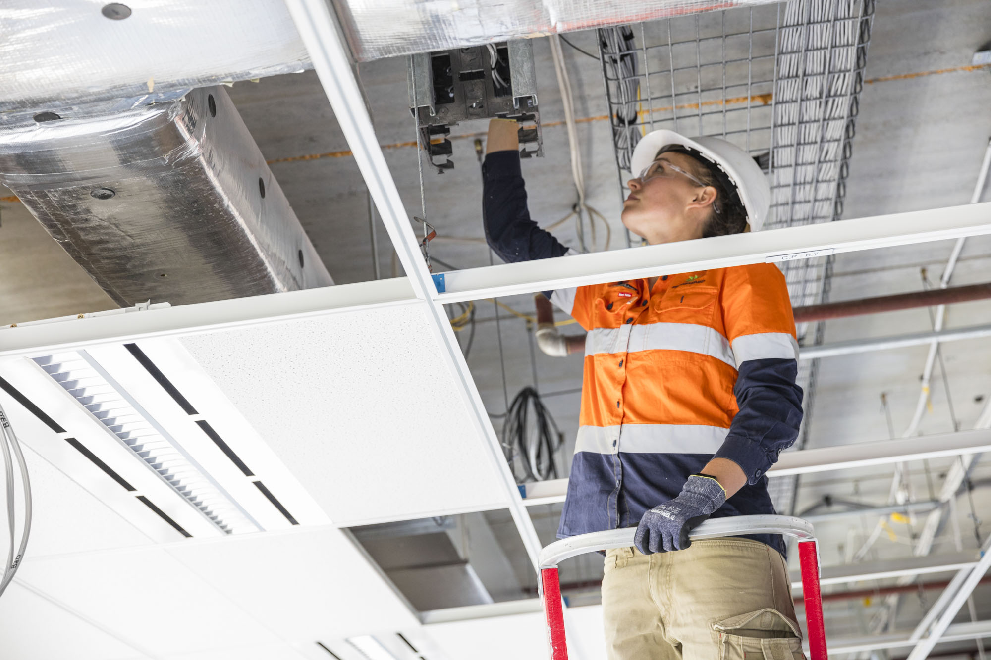Programmed tradie working in ceiling